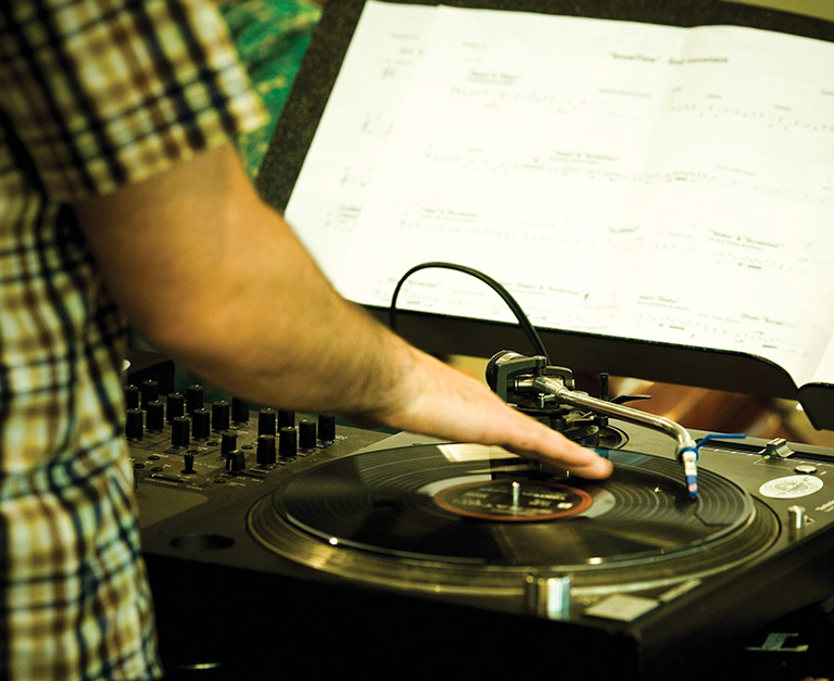 Close up of DJ playing his decks