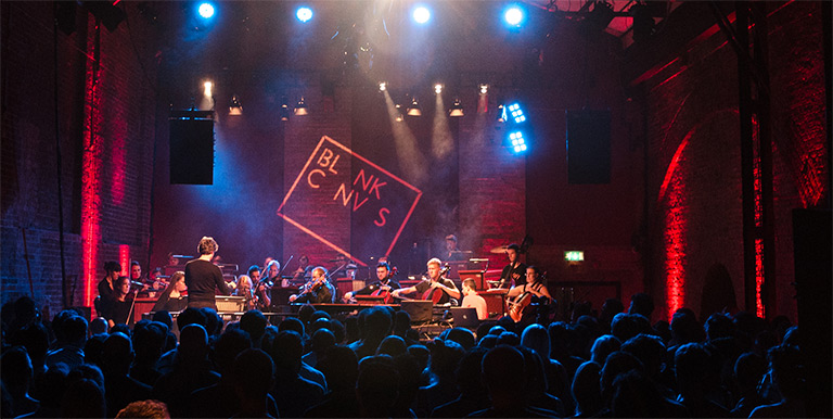 Musicians playing to a crowd